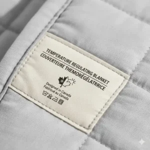 Close-up illustration of a product label featuring English and French text for "Temperature Regulating Blanket / Couverture thermorégulatrice."