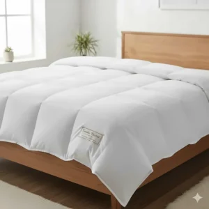 An illustration of a fluffy, hypoallergenic down-alternative queen size winter blanket laid out on a bed.