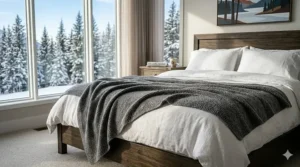 Aesthetic bedroom layout in a Toronto condo featuring a stylishly draped Cal King blanket for tall occupants.