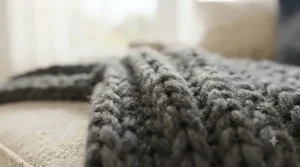 Close-up texture of a soft, breathable knit sofa throw for sectional couch designed for all-season Canadian comfort.