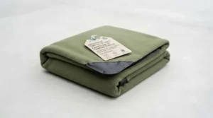Easy-to-clean machine washable waterproof camping blanket designed to quickly shake off dirt, sand, and mud.
